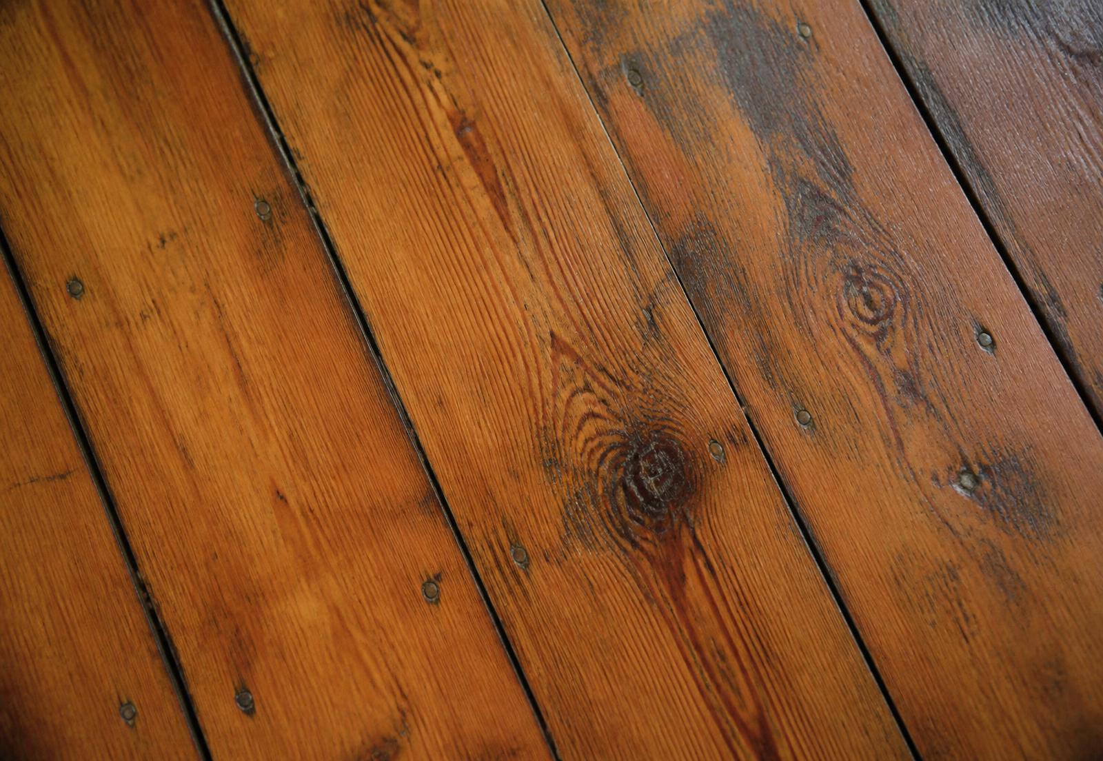 Reclaimed heart-pine floorboards in a NoDa mill loft