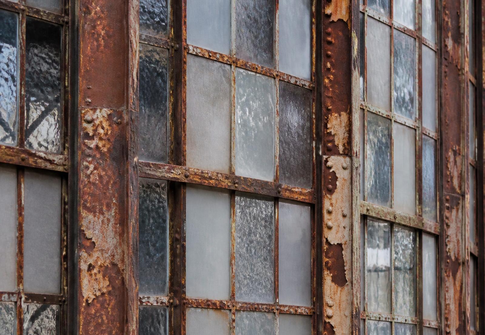 Steel factory window frames on a NoDa mill building